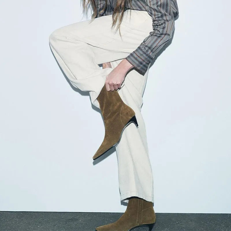 Brown square toe women's ankle boots with a side zip and a mid kitten heel on a waterproof platform sole.
