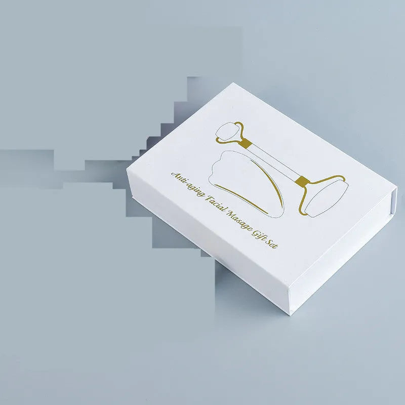 White jade double-headed facial roller and optional wooden gua sha scraping board.