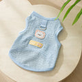 Green knitted cat clothes with bear patch showing hollowed-out breathable design
