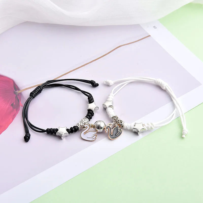 Magnetic couple bracelets with crown and diamond designs in alloy electroplated construction