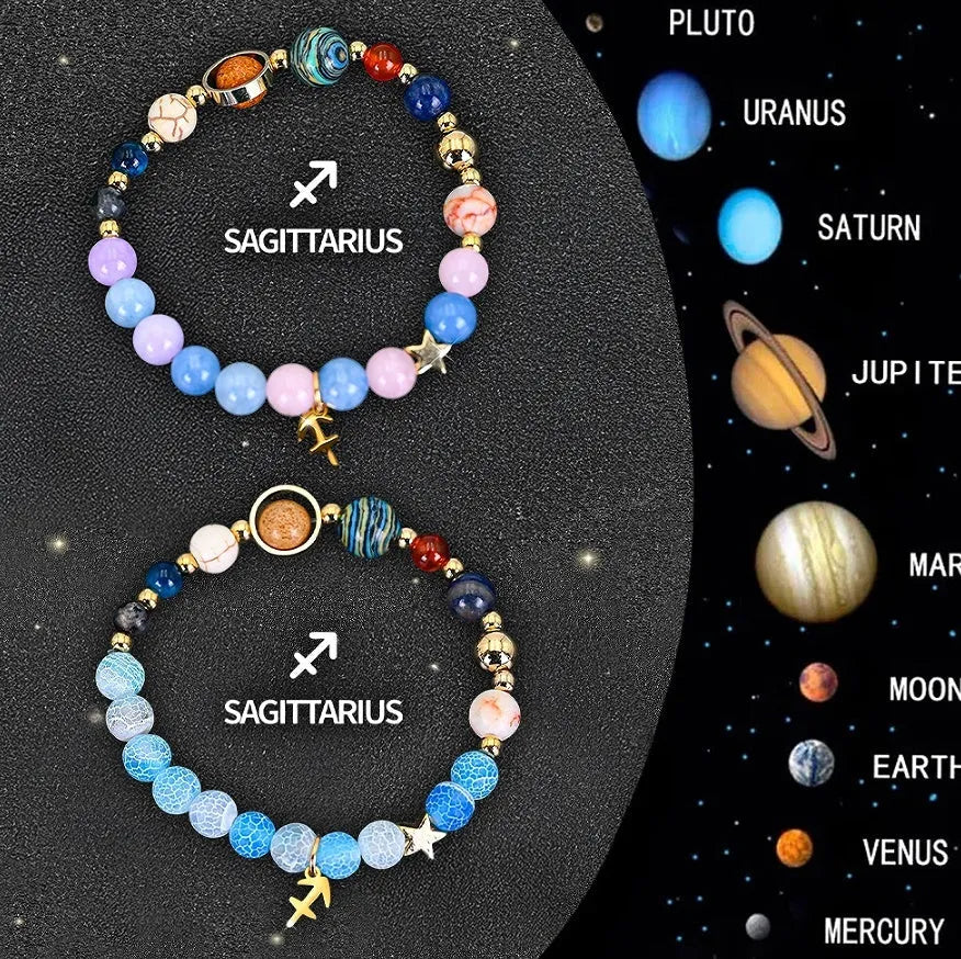 Set of two natural stone beaded bracelets with zodiac charms on a textured background.