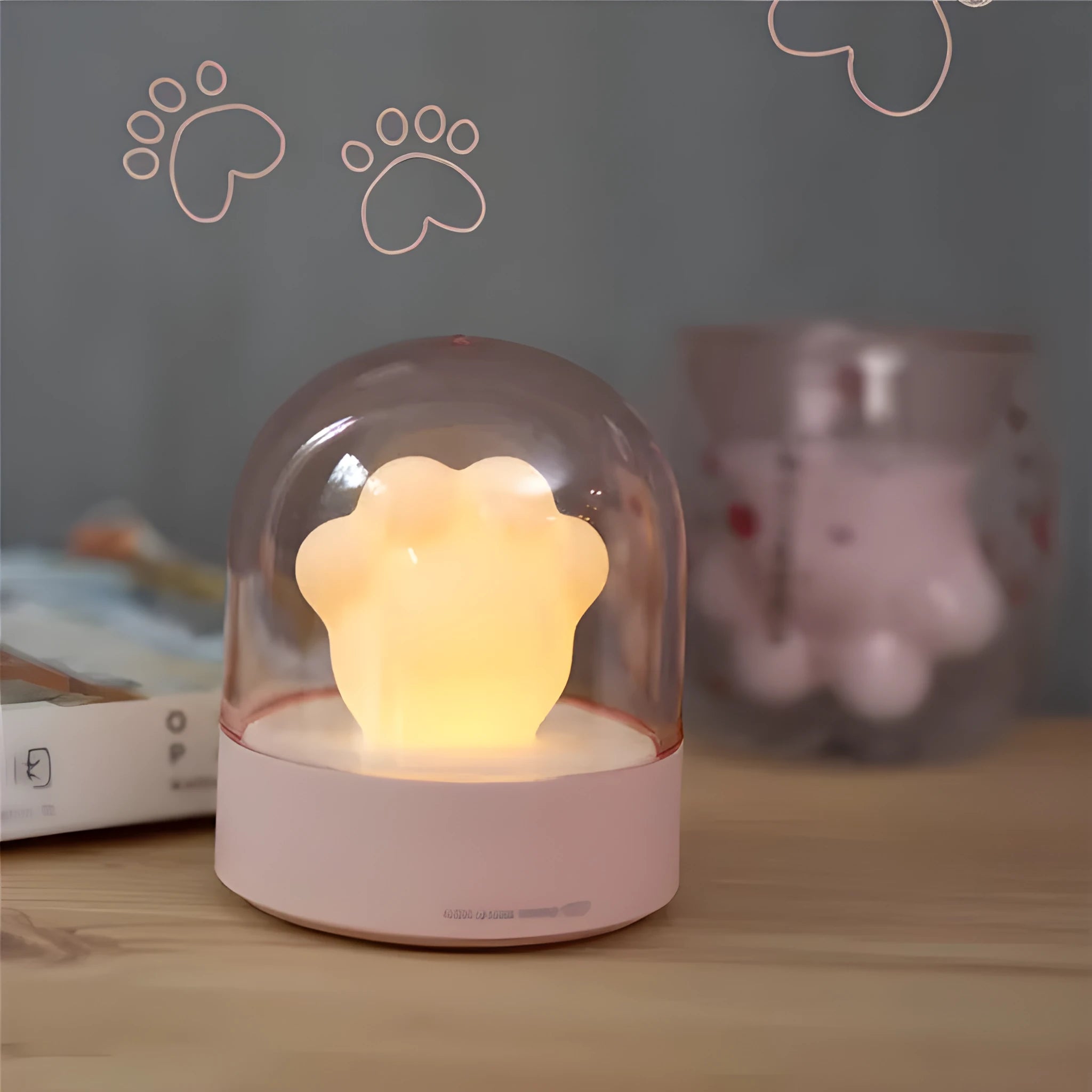 Grey cat paw shaped USB rechargeable night light with rotating musical display