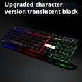 White and black gaming keyboard with glowing USB cable on a desktop
