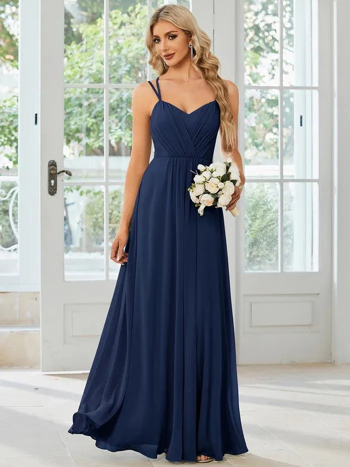 Women's sleeveless pleated A-line long dress in light green, shown in a solid colour with a long skirt.