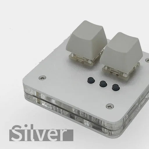 Compact white plastic USB keyboard with a touch panel and multimedia keys.
