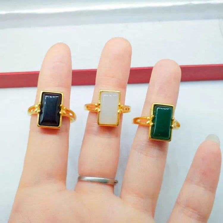 Adjustable brass gold-plated ring with artificial gemstones in black, green and white colour options
