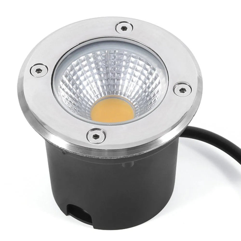 Black round LED COB underground light for outdoor garden and pathway illumination.