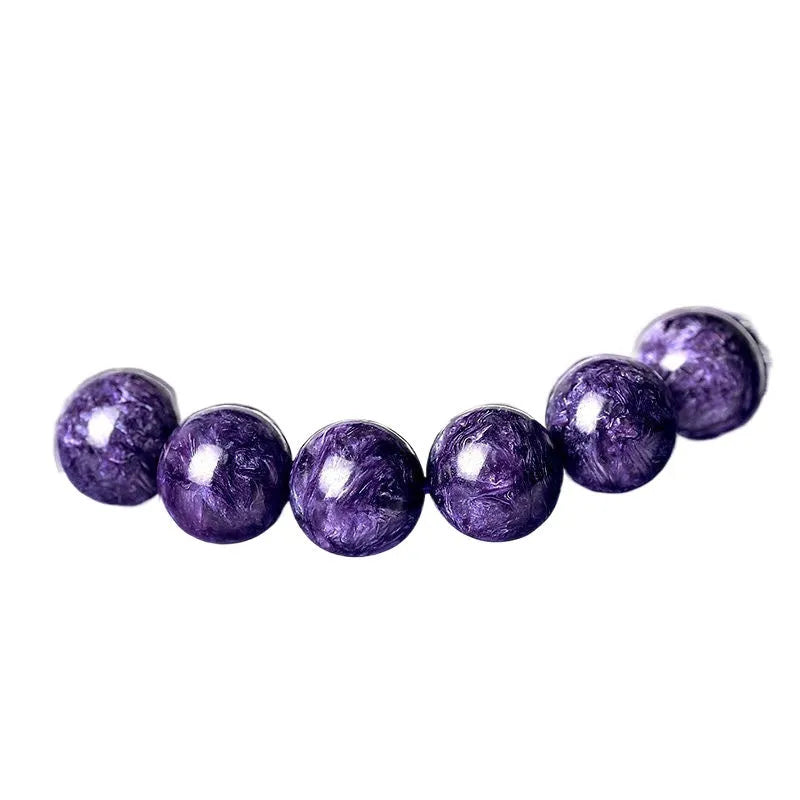 Natural transparent charoite crystal bracelet with platinum setting, showing different bead size options.