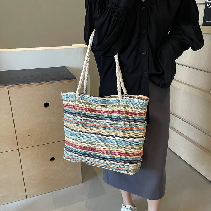 Blue straw woven nylon shoulder bag with single strap and woven texture pattern