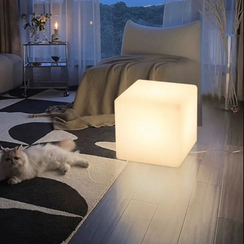 Square LED cube light stool in modern design showing waterproof PE construction with solar panel or charging port visible