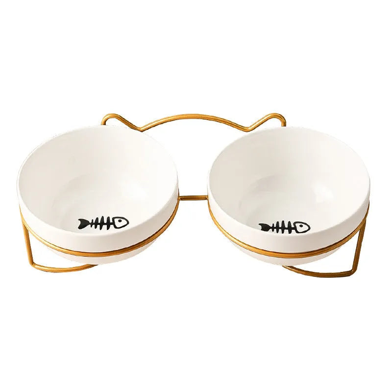 White ceramic cat bowl with cat paw print pattern in a black iron cat-ear frame