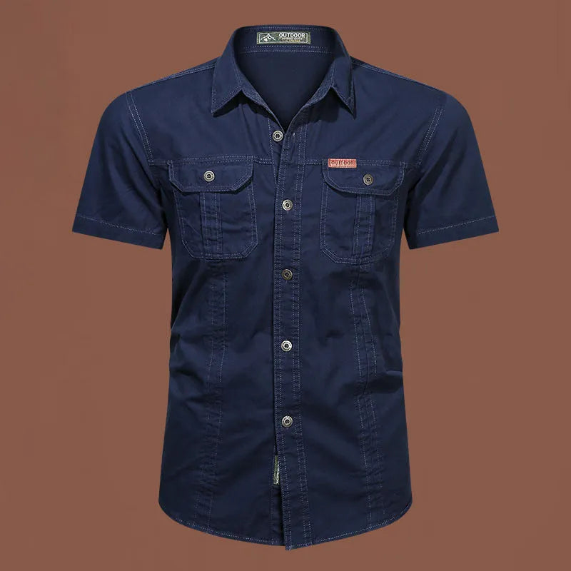 Men's army green cotton work shirt with short sleeves and a loose, non-iron fit.