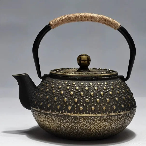 A cast iron teapot with Japanese-style hand-painted decoration, shown in a Bronze finish, with a capacity of 0.9 litres.