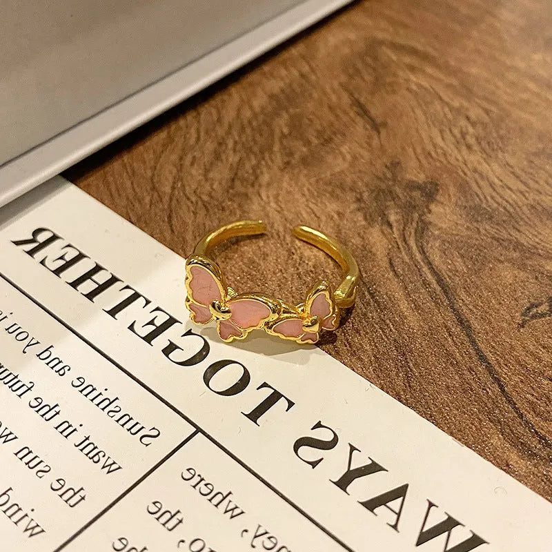 Butterfly design copper ring with oil-drip textured finish in women's jewellery