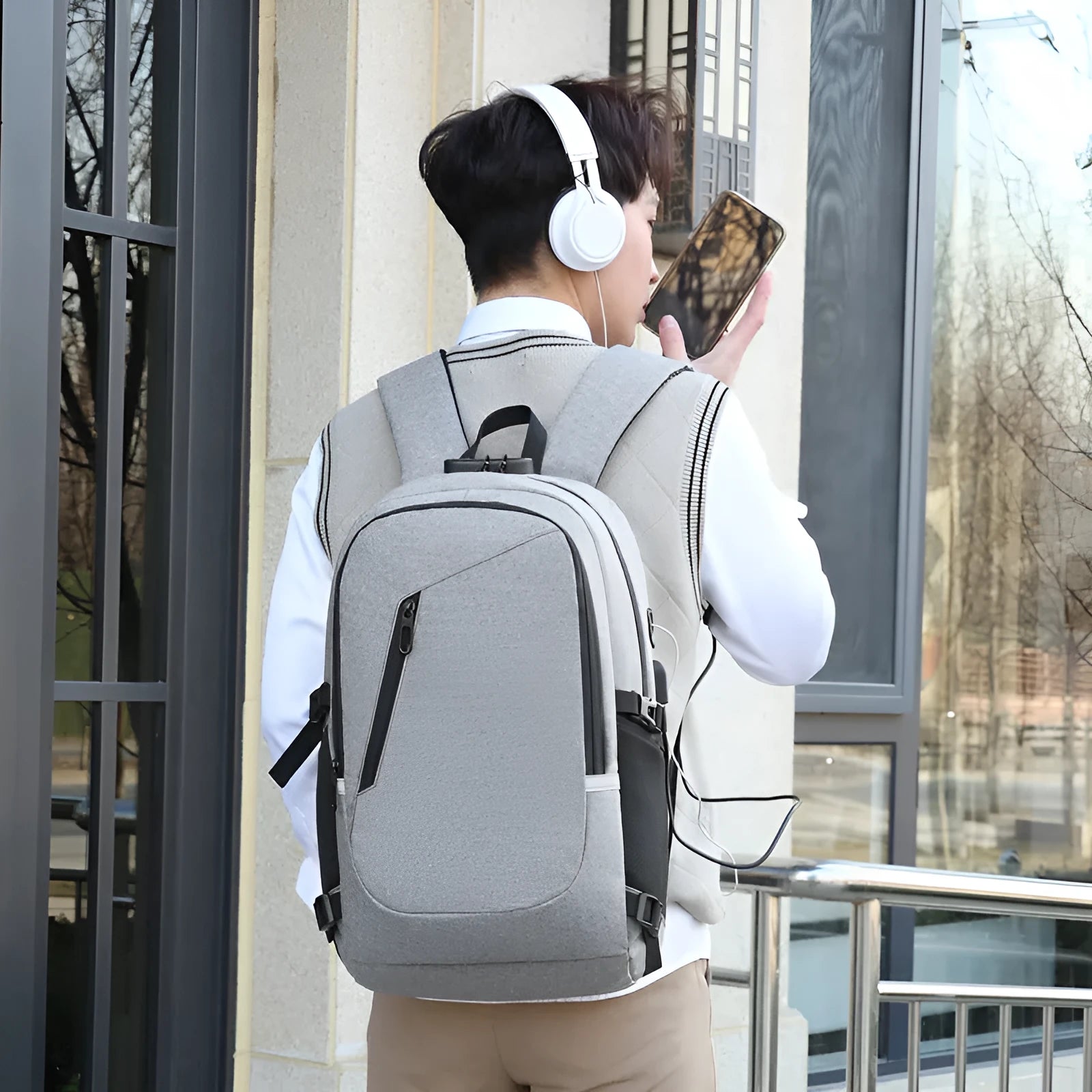 Street-style Oxford cloth backpack in blue colour showing front view with straps