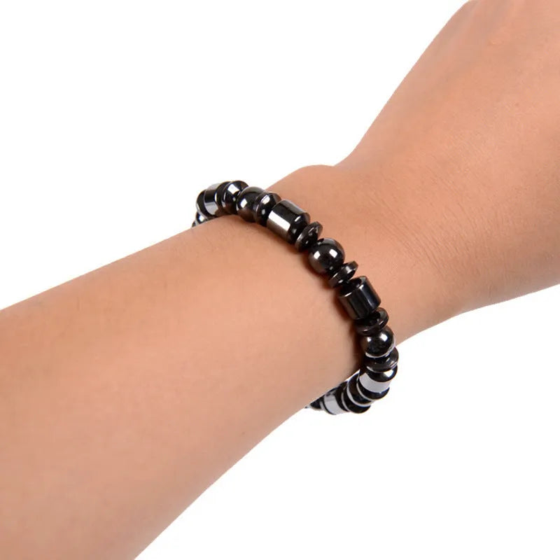Black stretch bracelet with a pentagram design made from magnetite and hematite stones.