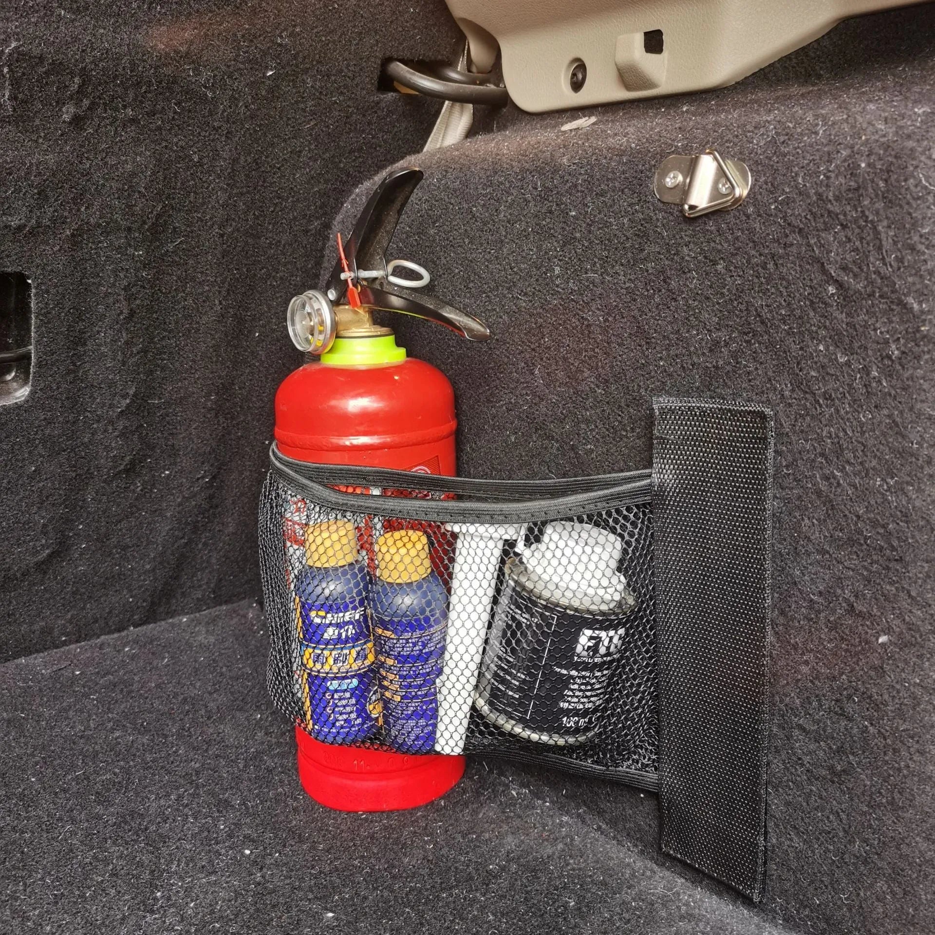 Elastic polyester car boot storage net shown in 20x45cm size securing loose items.