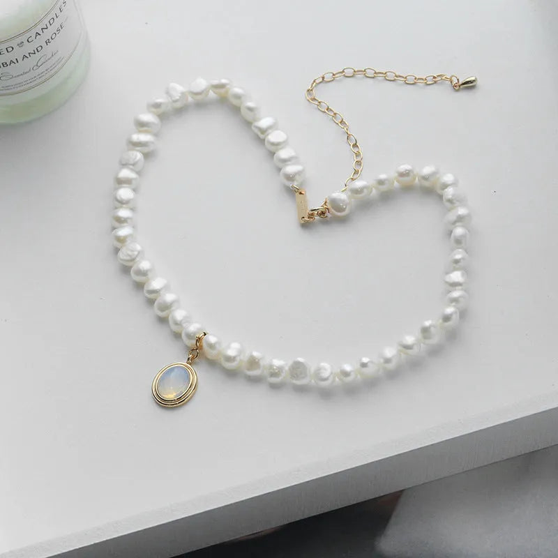 Geometric silver pendant necklace with irregular freshwater pearls on adjustable chain