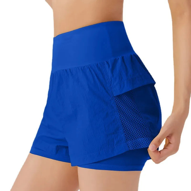 Women's loose casual quick-drying sports shorts in cotton blend fabric on a hanger.