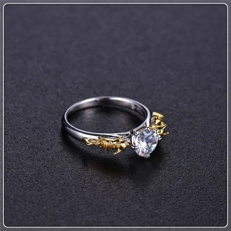 Copper crown modelling cosplay ring in a black gold finish on a hand.