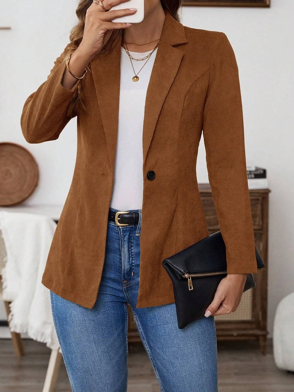 Brown single-breasted suit coat with lapel collar and long sleeves