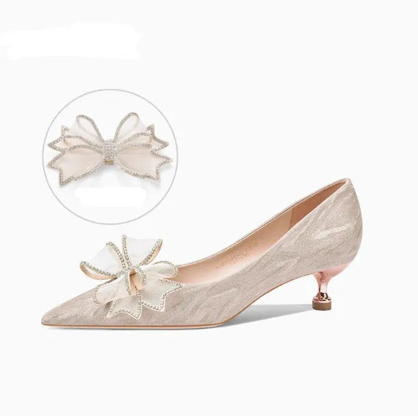 Women's champagne gold stiletto high heels covered in crystal sequins with a pointed toe.
