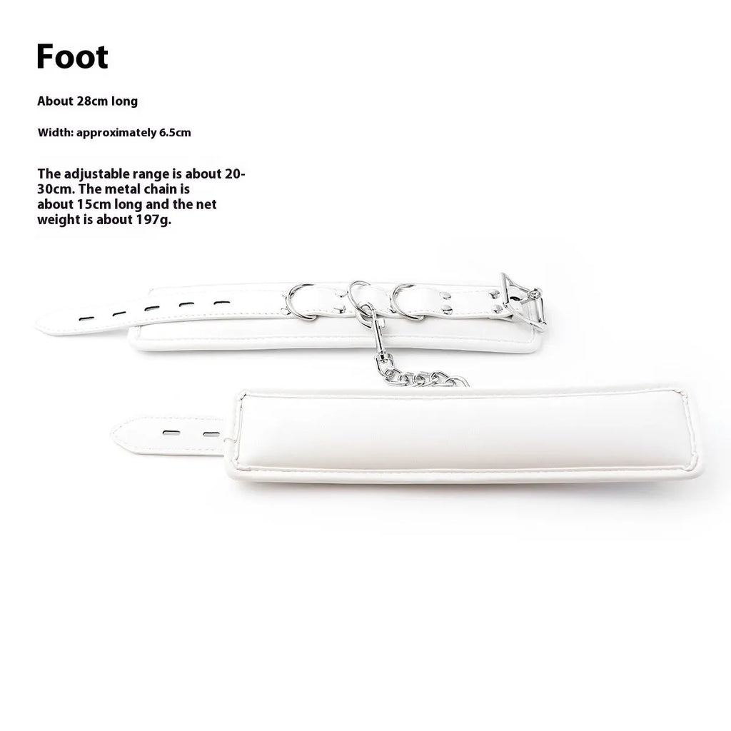 White PU sponge bondage restraint set showing handcuffs, foot cuffs, and a neck scarf.