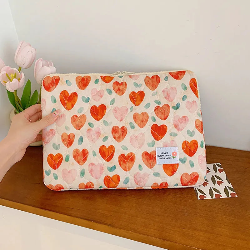 Women's floral print laptop bag in green flower pattern showing storage compartments