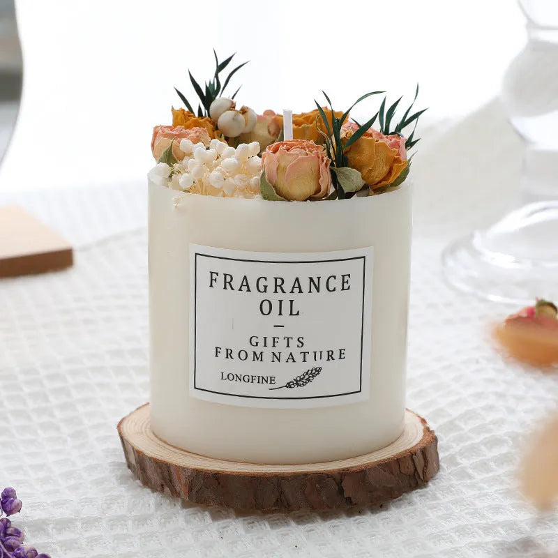 Glass jar scented candle with dried flower decoration, available in multiple fragrance options