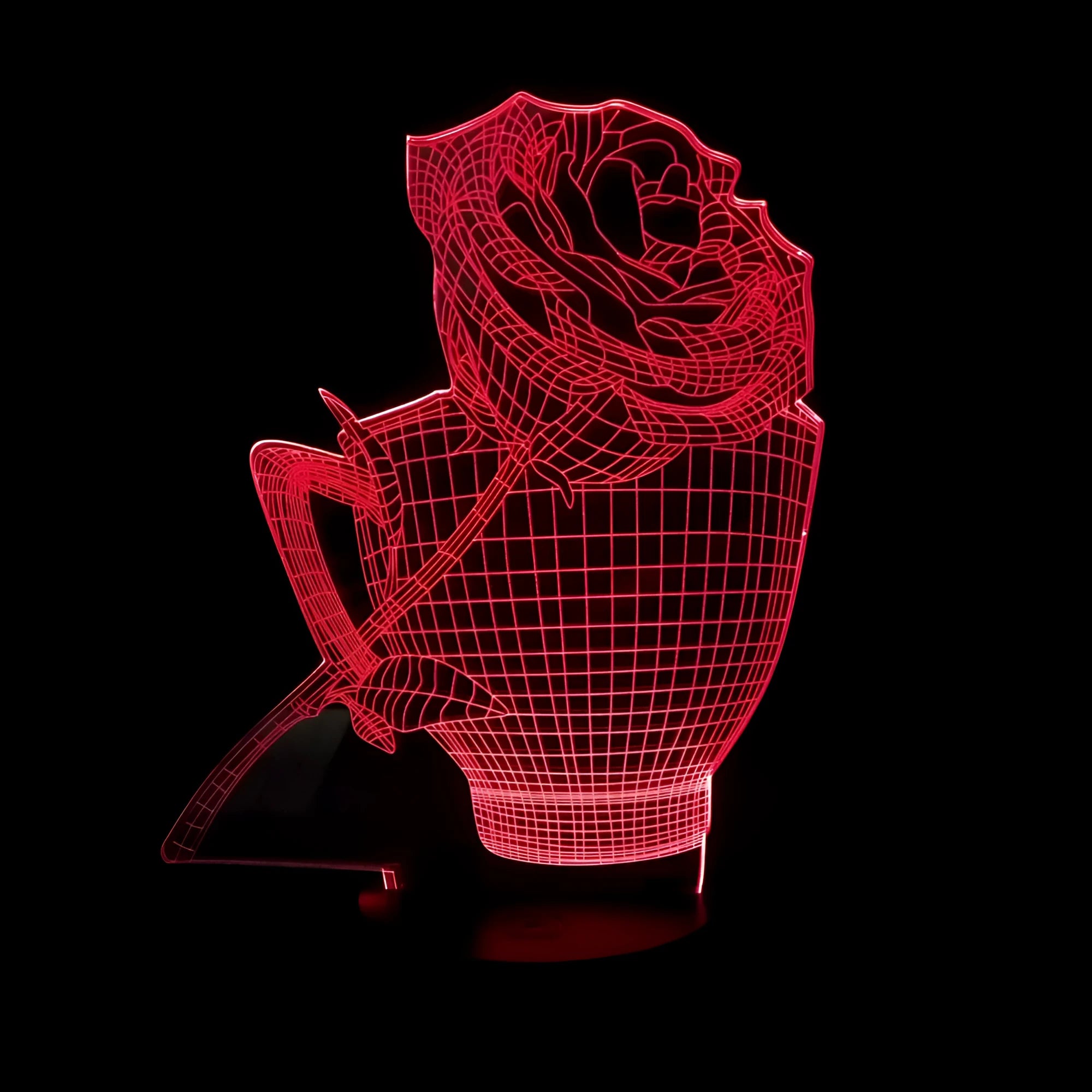 3D acrylic rose flower LED night light with remote control on a dark surface, showing colourful illumination.