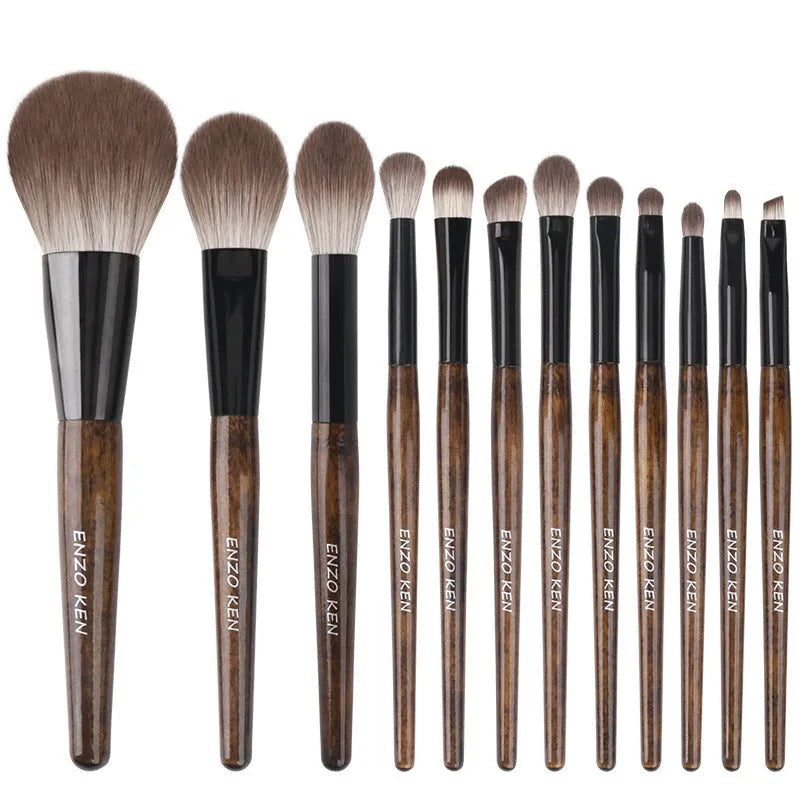 12 piece makeup brush set with wooden handles in a grey PU storage bag