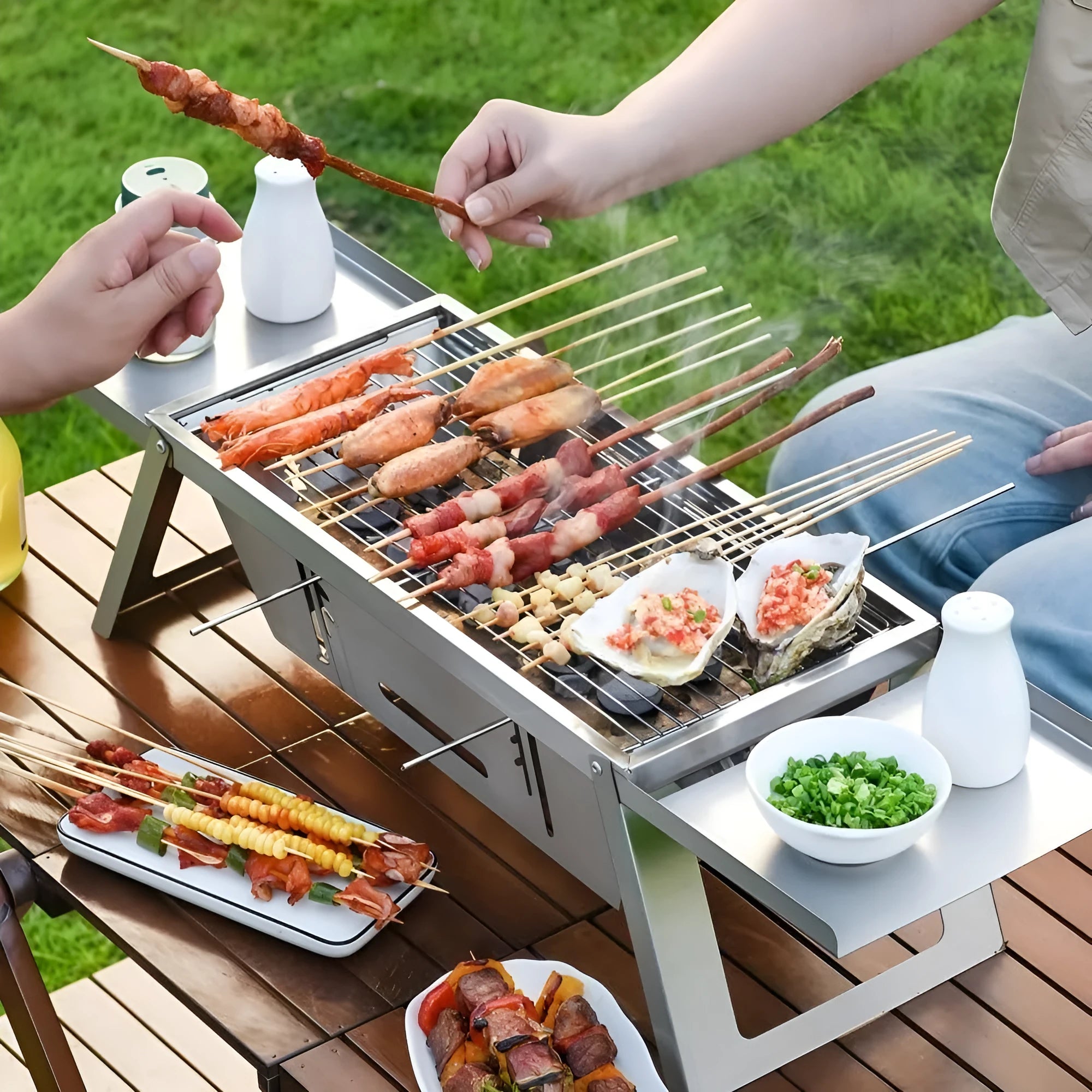 Small portable charcoal grill shown folded and unfolded for outdoor BBQ cooking