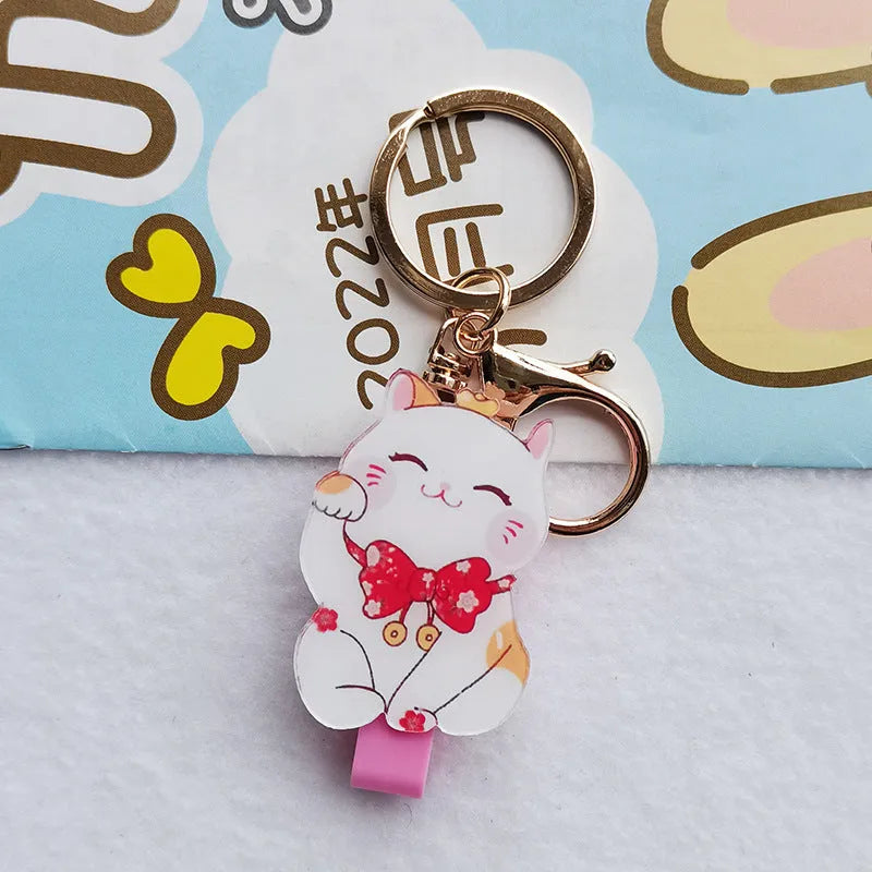 Lucky Cat blessing certificate set showing plastic card sleeve and ferrule pendant in cartoon style.