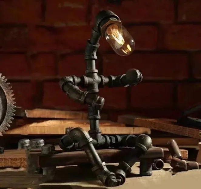 Vintage industrial robot table lamp with iron pipe design and water pipe light filtering