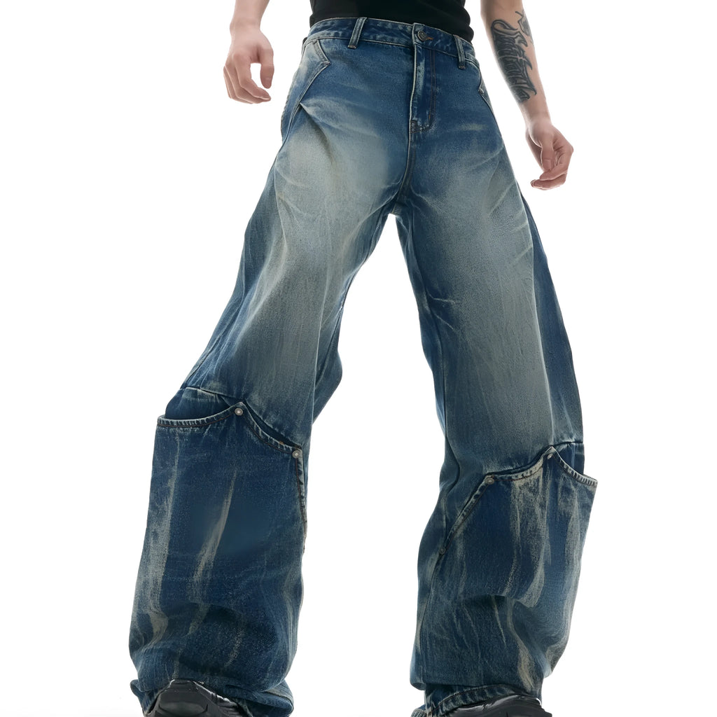 Men's verdant blue loose-fit jeans with a retro washed burst pattern and curved knife leg detail.