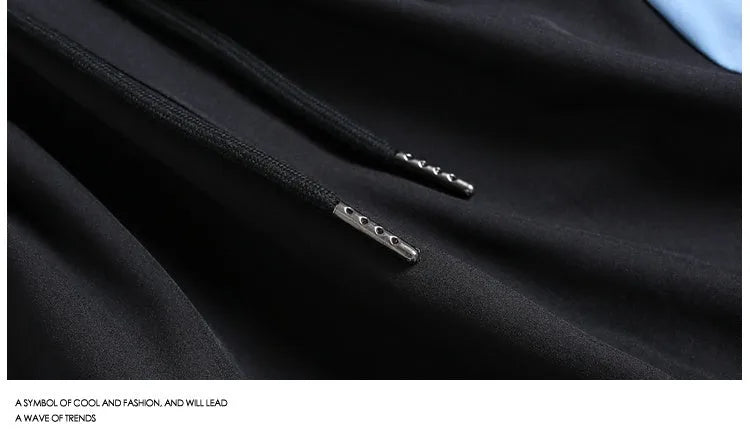 Man wearing loose black quick-drying sports shorts with an elastic waist for training.