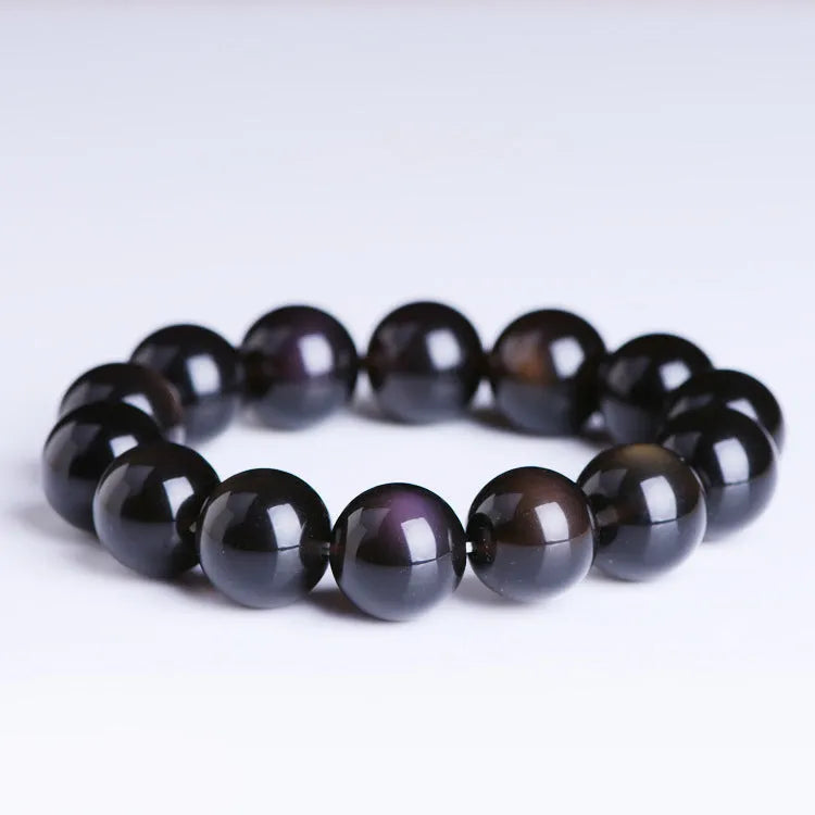 Natural crystal bracelet with a Pi Xiu charm and icy obsidian beads in geometric ethnic style.