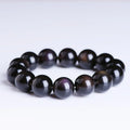 Natural crystal bracelet with a Pi Xiu charm and icy obsidian beads in geometric ethnic style.