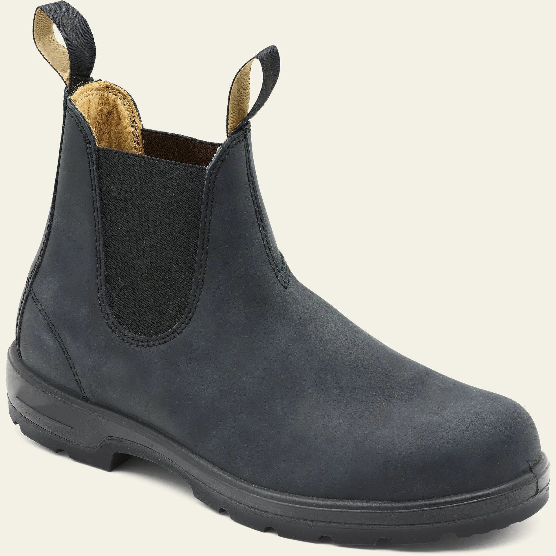 Vintage frosted brown leather Chelsea boot with round toe and low heel on a wooden surface.