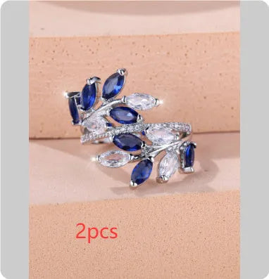 Adjustable copper leaf ring with horse eye zircon accents in multiple colour variations