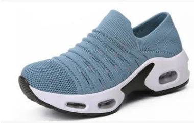 Women's plus size fly-knit socks shoes in dark blue with mesh upper and low heel, showing round toe design.