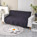 Reversible dog blanket sofa cover in burgundy and grey, laid flat on a sofa