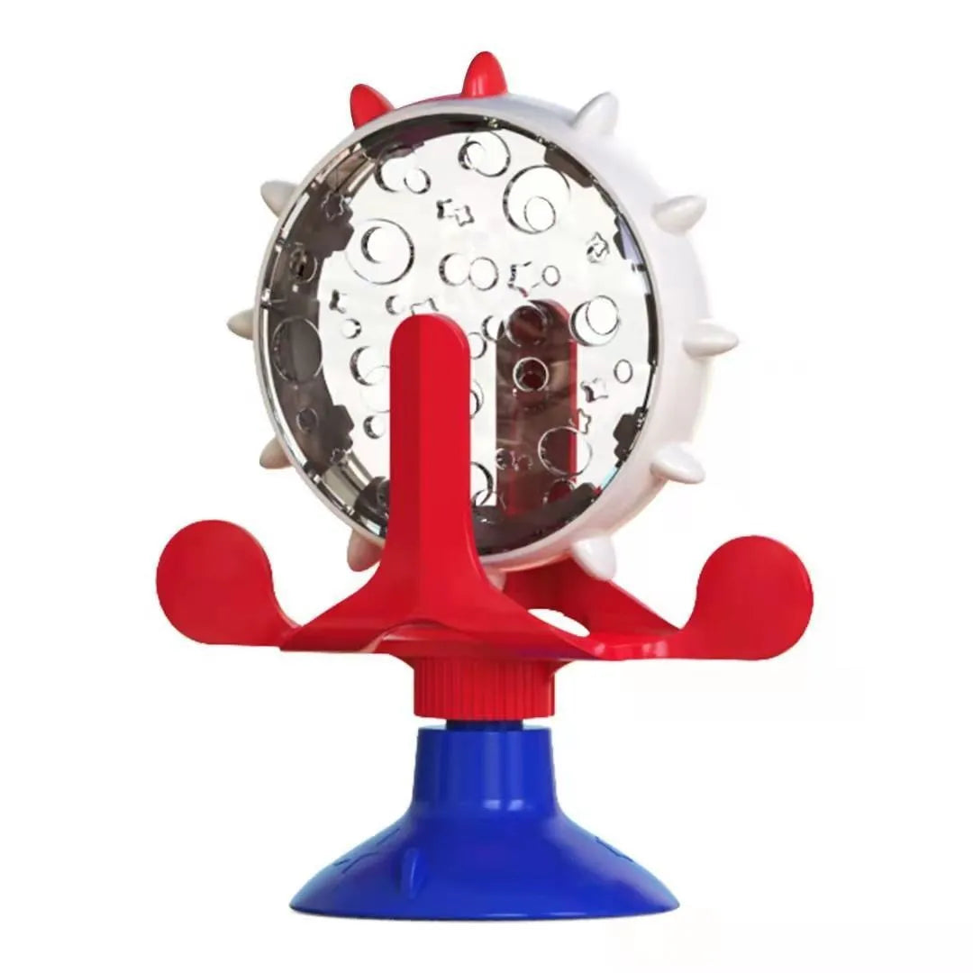 Blue interactive spinner puzzle toy for cats and dogs with suction base on a floor.