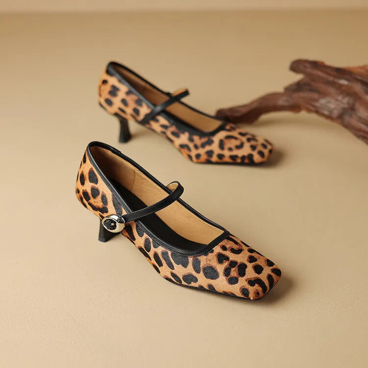 Women's black square toe stiletto heel ankle-strap shoes with horse hair upper.