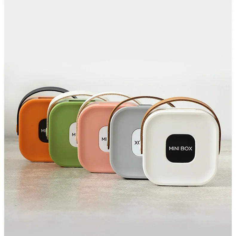 Medium polypropylene storage box with lid for organising cables and headsets, shown in Nordic White colour.