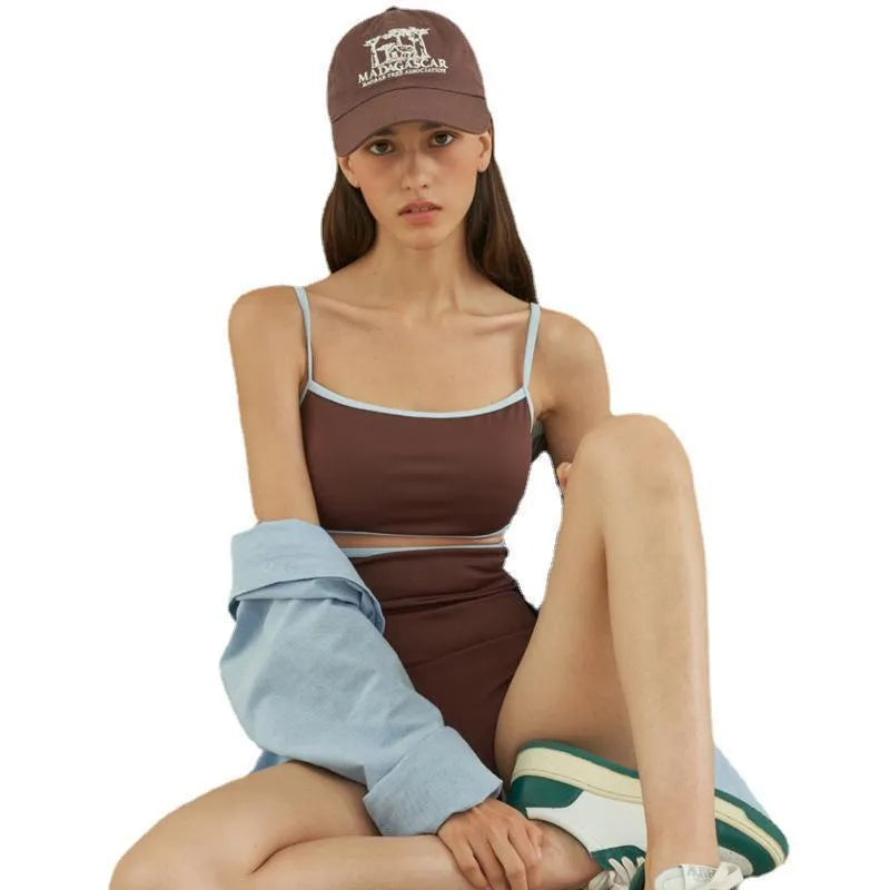 Brown one-piece swimsuit for women with triangle neckline on a mannequin