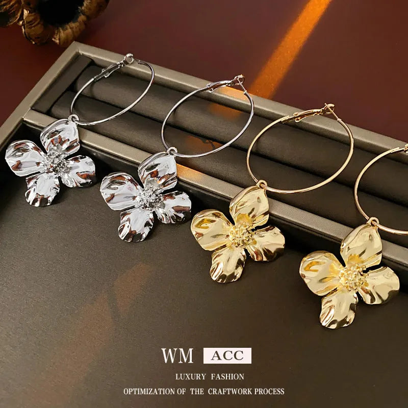 Metal flower geometric earrings with silver needle detail in gold or silver electroplated finish