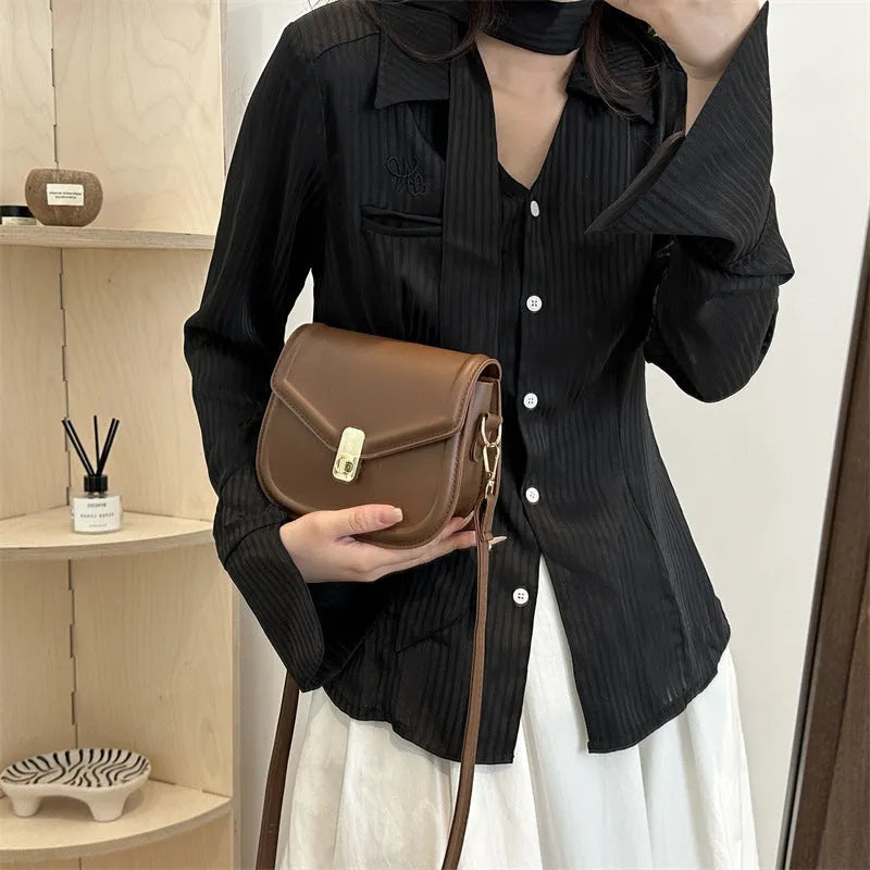 Soft textured PU leather messenger bag with clamshell opening, shown in a horizontal square shape.