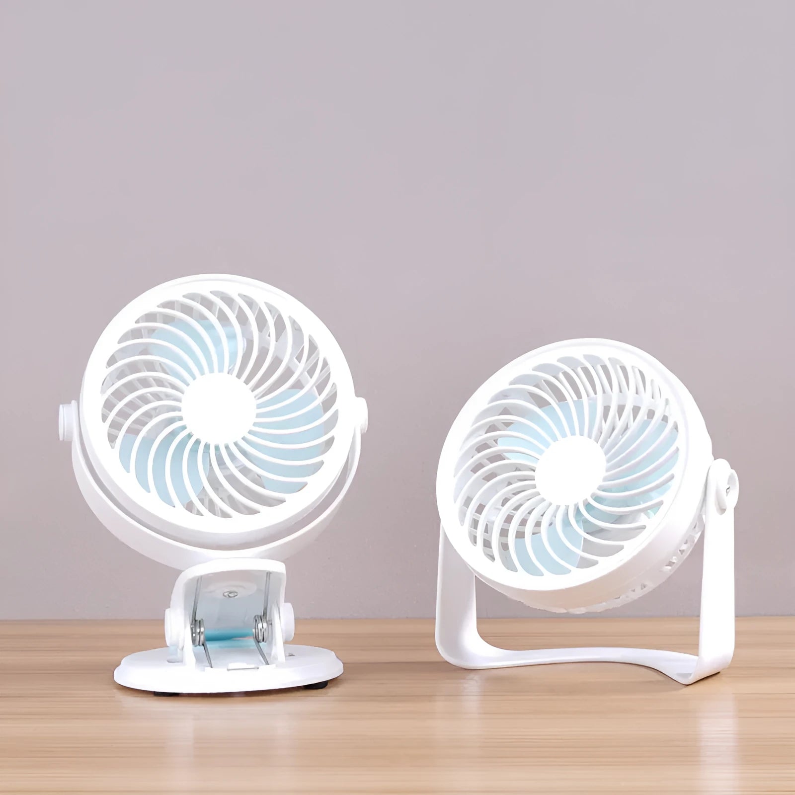 Small white USB desk fan shown in clip-on and floor-standing styles on a wooden desk.