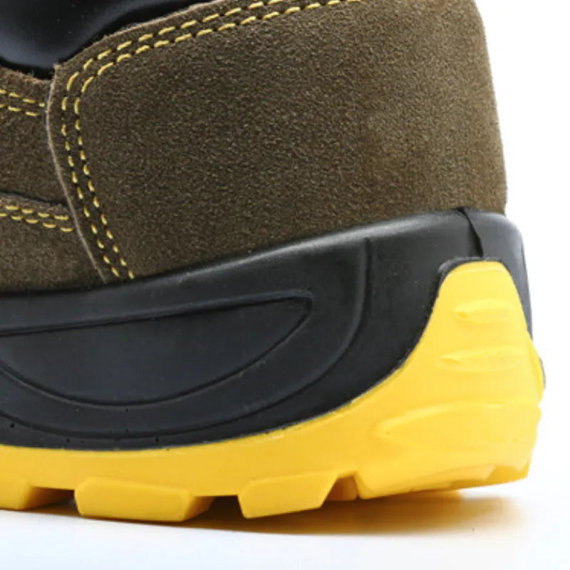 Bronze cow suede leather steel toe safety boots with non-slip sole on workplace surface